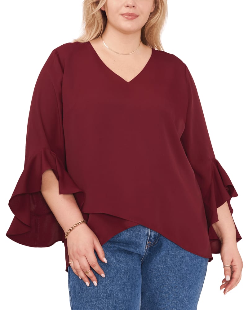 Front of a model wearing a size 1X Natalie Flutter Sleeve Tunic in CRISP MERLOT by Vince Camuto. | dia_product_style_image_id:261962